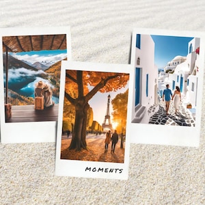 May include: Three polaroid-style photographs on sand. One shows a couple overlooking a mountain lake, another features the Eiffel Tower, and the last depicts a couple walking down a street. The word "MOMENTS" is written on one photo.