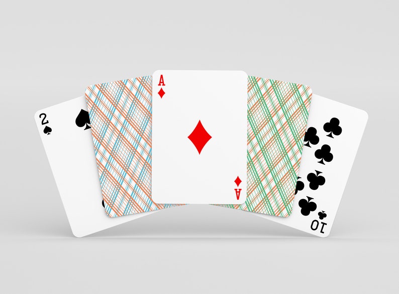 May include: Four playing cards fanned out, showing the Ace of Diamonds, the 2 of Spades, the 10 of Clubs, and the back of a card with a green and orange plaid pattern.