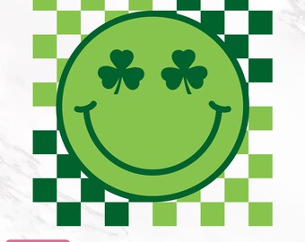 May include: A green smiley face with shamrock eyes on a black and white checkered background.