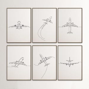 以下が含まれることがあります： 白壁に飾られた、黒枠のフレームに入った、飛行機の線画が描かれた白黒の線画プリント6枚セット。飛行機はそれぞれ異なる角度で描かれており、1本の線で描かれている。