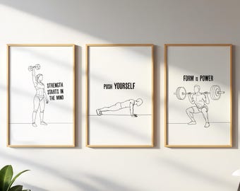 May include: Three framed art prints with minimalist line drawings of fitness exercises. The prints feature a woman lifting a dumbbell, a person doing push-ups, and a person squatting with a barbell. Each print has a motivational phrase.