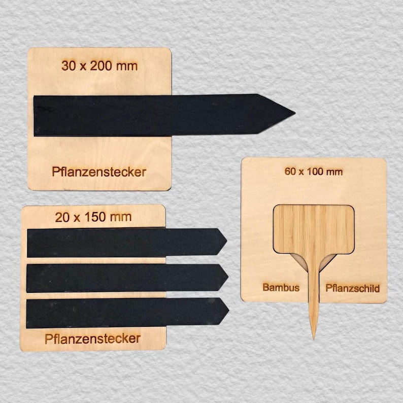 May include: Three light-colored wooden boards featuring black plant markers. One board shows a 30 x 200 mm marker, another shows three 20 x 150 mm markers, and the third displays a 60 x 100 mm bamboo plant label. Text includes 30 x 200 mm, 20 x 150 mm, 60 x 100 mm, Pflanzenstecker, Bambus, and Pflanzschild.