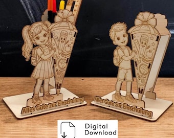 May include: Two light-colored wooden desk organizers featuring laser-cut designs of a girl and a boy holding school cones. Each base is engraved with the German text Alles Gute zur Einschulung. The organizers hold pens and a ruler.