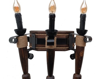 Wall lamp made of wood. Sconce for three torches in the Gothic style