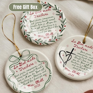 May include: Three white ceramic ornaments with gold string hangers. Each ornament has a unique design with the text "So God made Teachers" and a personalized message. The ornaments are decorated with red and green accents.