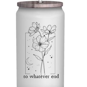 May include: White stainless steel tumbler with a wood lid and a black and white illustration of flowers, a crescent moon, and stars. The text "to whatever end" is printed below the illustration.