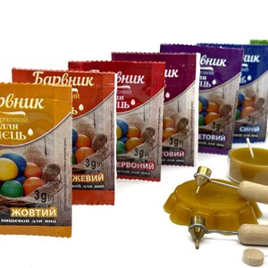 May include: A set of eight small packets of food coloring for dyeing Easter eggs. The packets are labeled with the colors: yellow, red, blue, green, and purple. Each packet contains 3 grams of coloring.