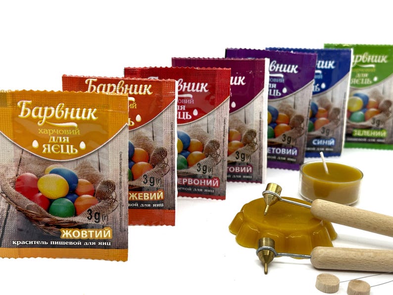 May include: A set of eight small packets of food coloring for dyeing Easter eggs. The packets are labeled with the colors: yellow, red, blue, green, and purple. Each packet contains 3 grams of coloring.