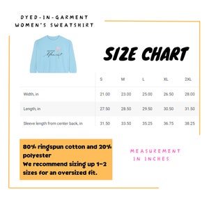 May include: A light blue women's sweatshirt with the text "Live in the Moment" and a floral design. The image includes a size chart with measurements in inches for width, length, and sleeve length. The sweatshirt is made of 80% ringspun cotton and 20% polyester.