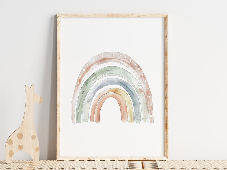 K&ouml;nnte beinhalten: Ein Aquarellbild eines Regenbogens in Braun-, Gr&uuml;n-, Blau- und Gelbt&ouml;nen. Der Regenbogen ist in einem hellen Holzrahmen gerahmt.