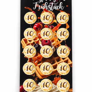 May include: A rectangular card with a black background featuring a waffle graphic with berries and syrup. The card displays fifteen circular icons, each marked with the number 10. The text Waffeln zum Frühstück is at the top, and Summe 150, is at the bottom.