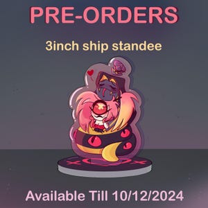 May include: A 3 inch tall acrylic stand-up figure of a pink and yellow snake character hugging a pink character with a single red eye. The characters are in a clear bubble with a red heart and a purple butterfly. The stand is on a black base with a red X. The text "Available Till 10/12/2024" is below the stand.