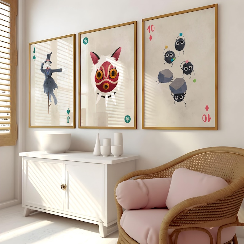 May include: Three framed prints with a vintage aesthetic. The prints feature a character from the movie Spirited Away, a No Face mask, and a card with the number 10 of diamonds and a group of soot sprites.