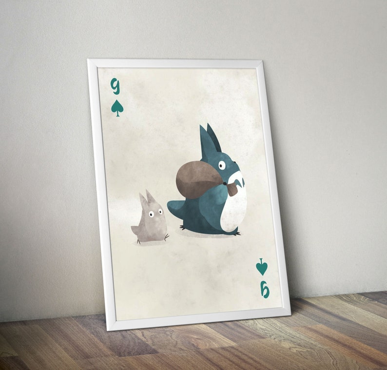 May include: A playing card with a 9 of spades design. The card features a cartoon illustration of two characters from the animated film My Neighbor Totoro. The larger character is blue and carrying a brown bag. The smaller character is gray and walking behind the larger character.