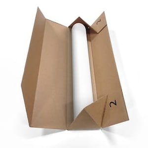 May include: A brown cardboard tube with a white label and the number "2" printed on it. The tube is open and the inside is empty.