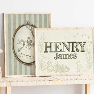 May include: Two framed prints with Winnie the Pooh illustrations. One has a striped background and a circular image of Pooh and Piglet. The other print says "HENRY James" in green letters, with more Pooh illustrations.