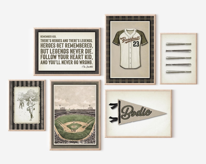 May include: A collection of framed baseball-themed art prints. The prints include a baseball jersey, baseball bats, a stadium illustration, a pennant with the name "Bodie", and a print with the text "REMEMBER KID..." in a vintage style.