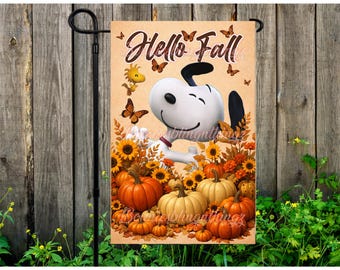 May include: A rectangular garden flag featuring a white cartoon dog with black ears and a small yellow bird. The text Hello Fall is printed at the top. The scene includes orange pumpkins, yellow sunflowers, and brown butterflies on a tan background.