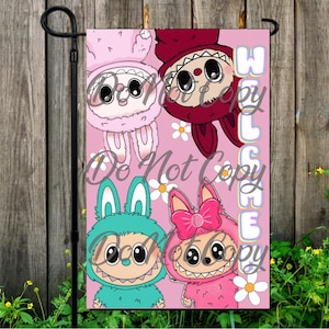 May include: A pink garden flag featuring four cartoon monsters in different colors, each with large eyes and a toothy grin. The flag has the word "WELCOME" in white and the words "Do Not Copy" in white. White daisies are scattered around the monsters.