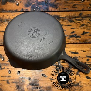 May include: A rustic wooden sign with the text "Welcome to our home" in white lettering. The sign features a distressed finish and a simple, inviting design, perfect for entryway decor.