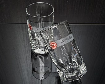 2x vintage Jameson Irish Whiskey glass with white inscription and John Jameson & son logo circled in gold. Jameson brand. Ireland. 1970s.