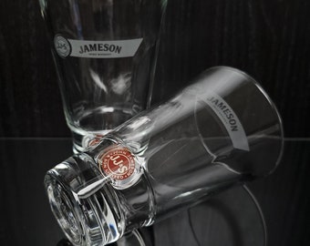 2x Jameson Irish Whiskey glass with white inscription. John Jameson & son logo circled in gold. Jameson brand.