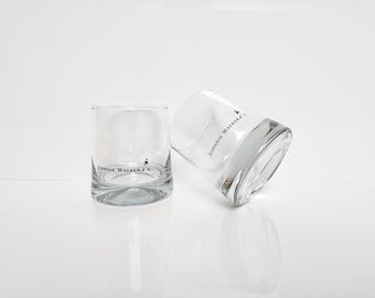 Two vintage Johnnie Walker whiskey glasses. Black logo and text print with a walking man. Heavy glasses. Whiskey glasses, cocktail glasses.