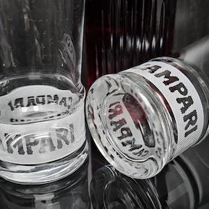 2 vintage Campari long drink glasses. Decorated with a white inscription 'Campari'. Italy 1980s.
