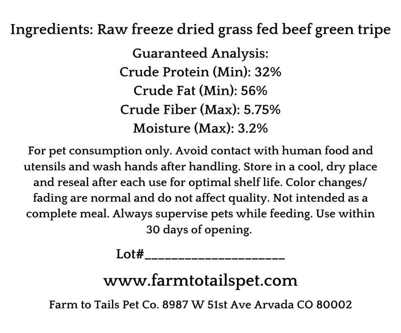 May include: A white label with black text detailing the ingredients and guaranteed analysis of raw freeze-dried grass-fed beef green tripe for pets. The label includes instructions for use and storage, and the website address.