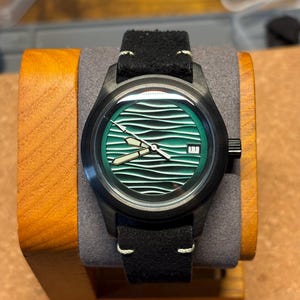 Quartz date watch green wave dial black suede strap