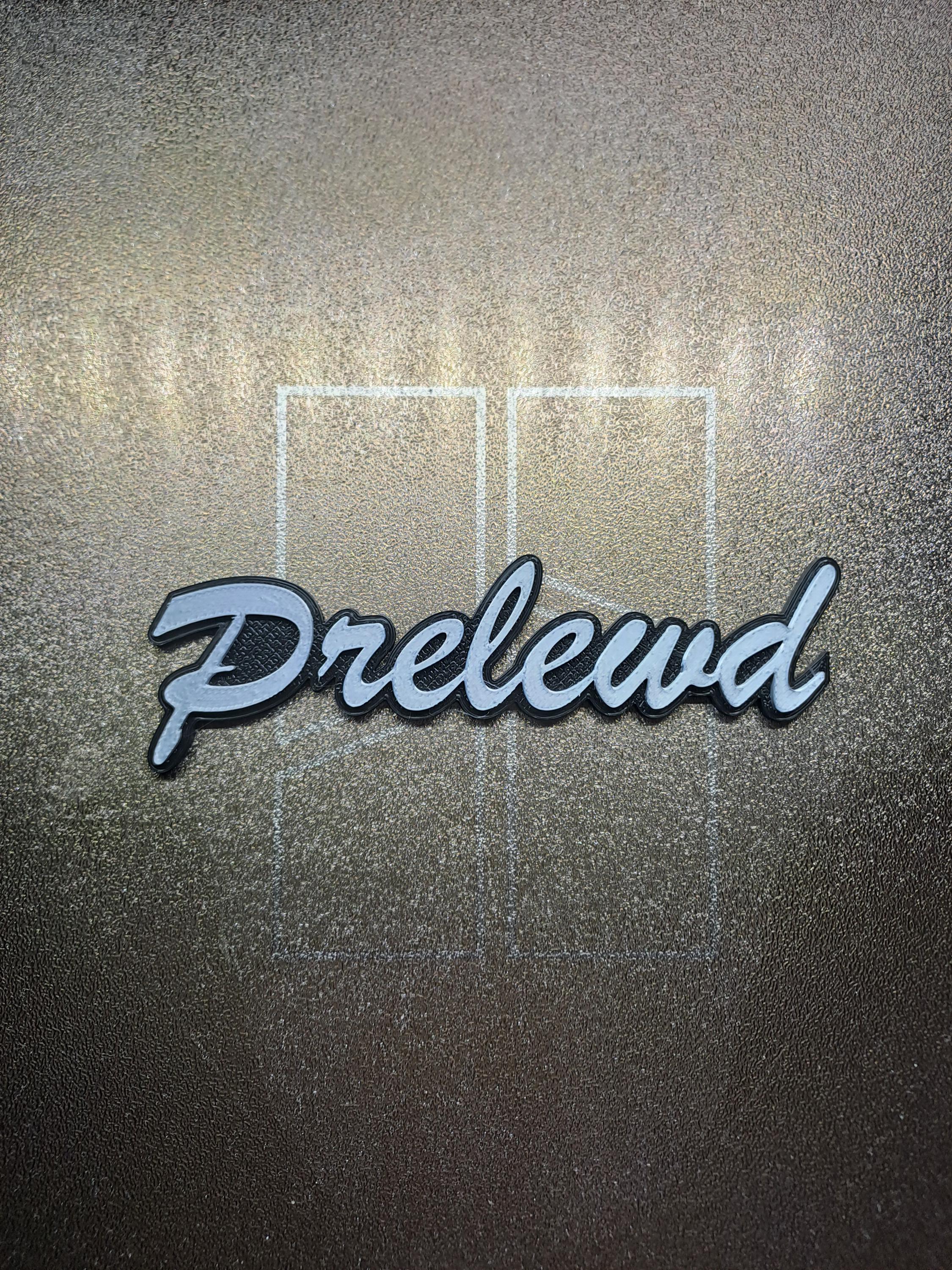 thumbnail image 2 of Honda Prelude Rear Bumper Emblem Badge – 3D Resin, Chrome Silver, Glossy Finish 2 of 3