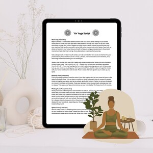 May include: A digital tablet displaying a Yin Yoga script with instructions for a warm-up, Butterfly Pose, Melting Heart Pose, and Spine Pose. The tablet is on a table with a decorative plant and candles. A woman is sitting in a yoga pose on a tan mat with a green and brown outfit.