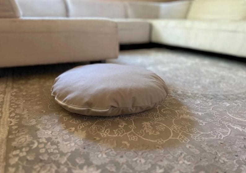 round dog bed cover beige cotton canvas on floor minimalist interior