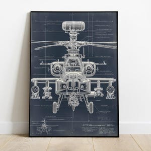 May include: A framed print featuring a white blueprint of a helicopter on a dark blue background. The technical drawing shows the helicopter's components, with a black frame. The print is displayed on a wooden floor.