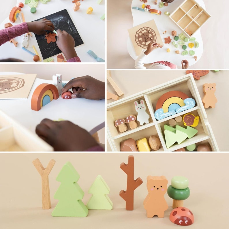 Pode incluir: Conjunto de brinquedos de madeira com um arco-&iacute;ris, &aacute;rvores, um urso, um cogumelo, um caracol e uma joaninha. O conjunto est&aacute; numa caixa de madeira com compartimentos. Os brinquedos s&atilde;o pintados em cores pastel.