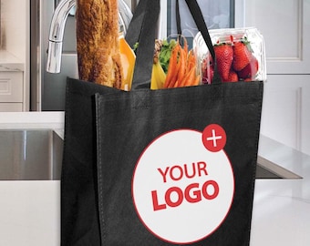 May include: A black reusable shopping bag filled with groceries, including a loaf of bread, juice, carrots, bananas, and strawberries. The bag has a white circle with the text "YOUR LOGO" in red.