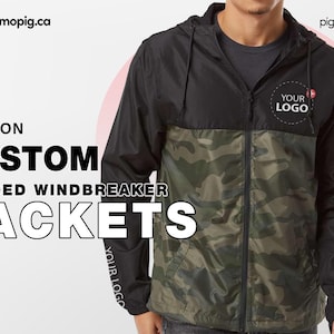 Peut inclure: Une veste coupe-vent à capuche noire et camouflage avec une fermeture éclair. La veste a une capuche noire et un panneau noir sur la poitrine. Le texte "YOUR LOGO" est imprimé sur le panneau de la poitrine. La veste est une excellente option pour la personnaliser avec votre propre logo ou design.