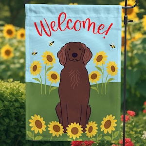 May include: Welcome garden flag featuring a brown dog sitting in a field of sunflowers with bees flying around. The flag is blue with white text that says "Welcome!"
