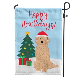 May include: A light blue garden flag with the text "Happy Howlidays!" in red script. The flag features a cartoon dog wearing a Santa hat, a decorated Christmas tree, and wrapped gifts.