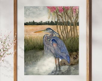 May include: Watercolor painting of a blue heron standing in a marsh with pink flowers in the background.