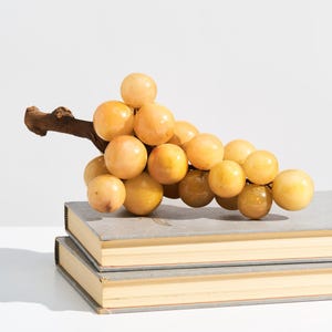 Vintage MCM Stone Bunch of Grapes // Retro Mid-Century Peachy Yellow Alabaster Grape Cluster on Wood Stem