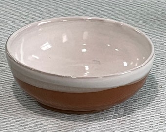 small tan and white bowl