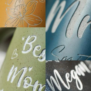 May include: Four different ceramic mugs with white lettering. The mugs are in various colors, including yellow, green, blue, and black. The lettering on the mugs includes the words "Gathering", "Best Mom", "Megan", and "Smith".