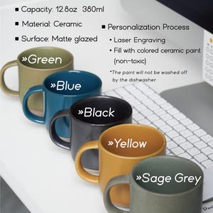 May include: Five ceramic mugs in different colors: green, blue, black, yellow, and sage grey. The mugs are 12.8 ounces or 380 milliliters and have a matte glazed finish. The mugs are food safe, microwave safe, and dishwasher safe. The text "Oneup custom ceramic gifts" is at the bottom of the image.