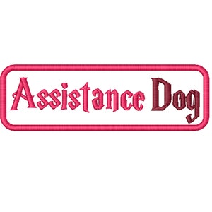 May include: A pink rectangular patch with a white background and the text "Assistance Dog" in a stylised font.