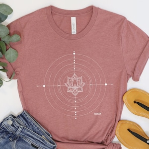 Person wearing a T-shirt displaying 'Target Inner Peace' by Haugen, an abstract art piece, ideal gift for yogis and meditation enthusiasts embracing balance and mindfulness.