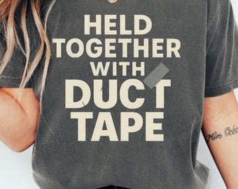 Held Together With Duct Tape Funny Sarcastic Shirt | Exhausted Human Tee | Humor Gift