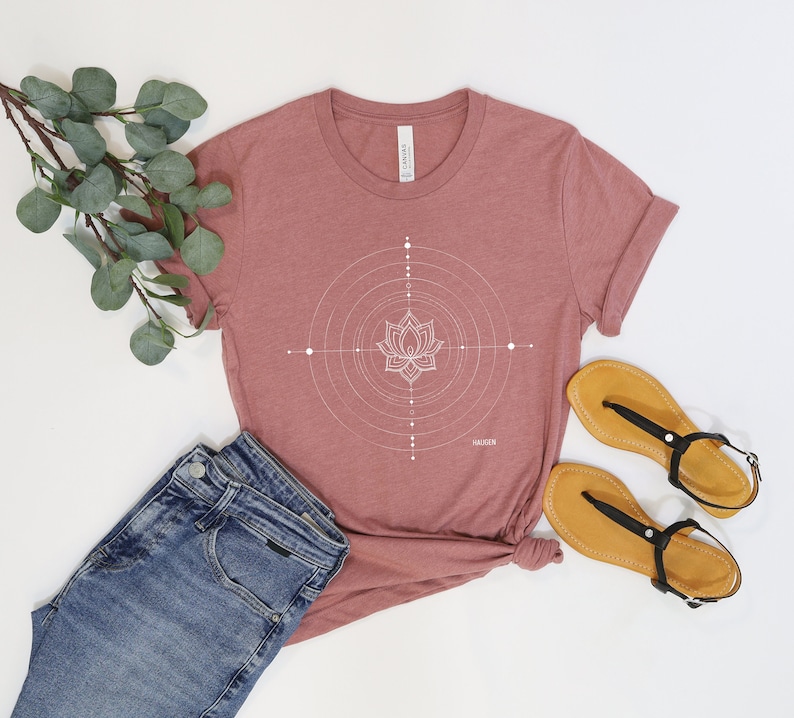 Person wearing a T-shirt displaying 'Target Inner Peace' by Haugen, an abstract art piece, ideal gift for yogis and meditation enthusiasts embracing balance and mindfulness.