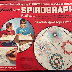 May include: A vintage Spirograph set in a red box. The box features the text "Kenner's NEW SPIROGRAPH" and illustrations of children using the toy. The set includes wheels, rings, and pens for creating geometric designs. The box also shows examples of the patterns that can be made.