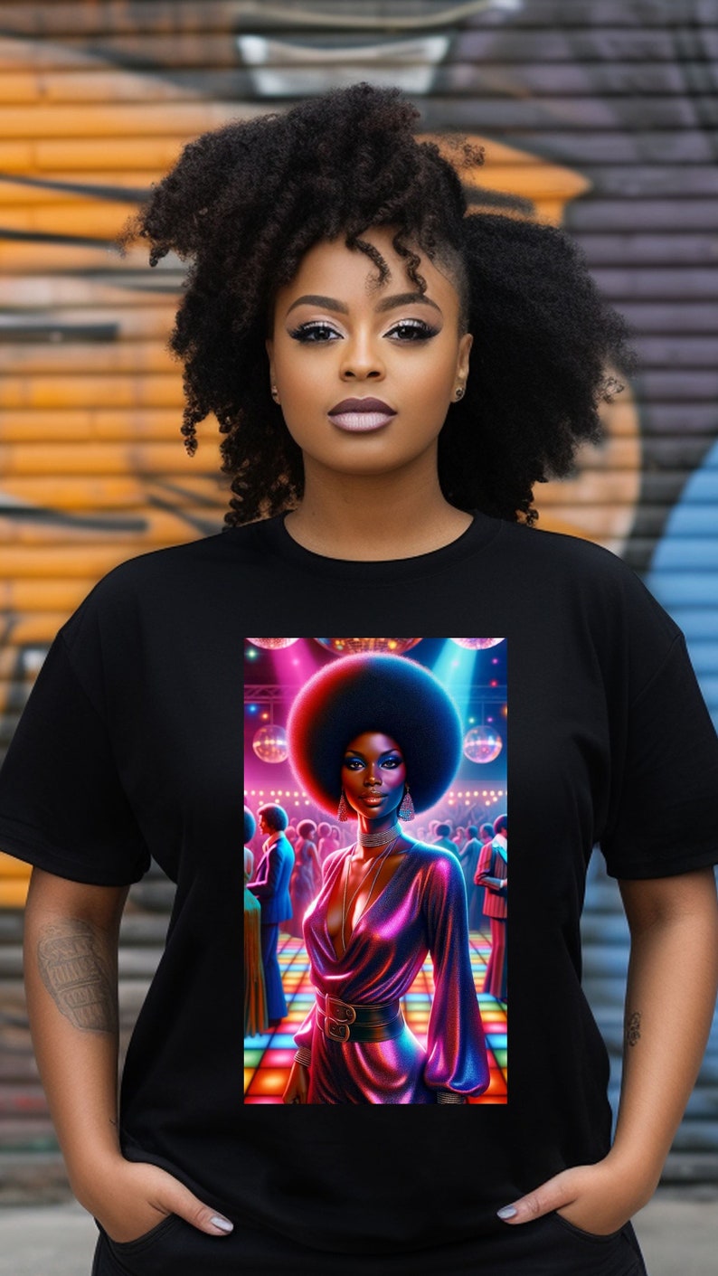 May include: Black t-shirt with a graphic print of a woman with an afro hairstyle dancing in a disco setting. The woman is wearing a pink and purple sequined dress and is surrounded by disco balls and lights.